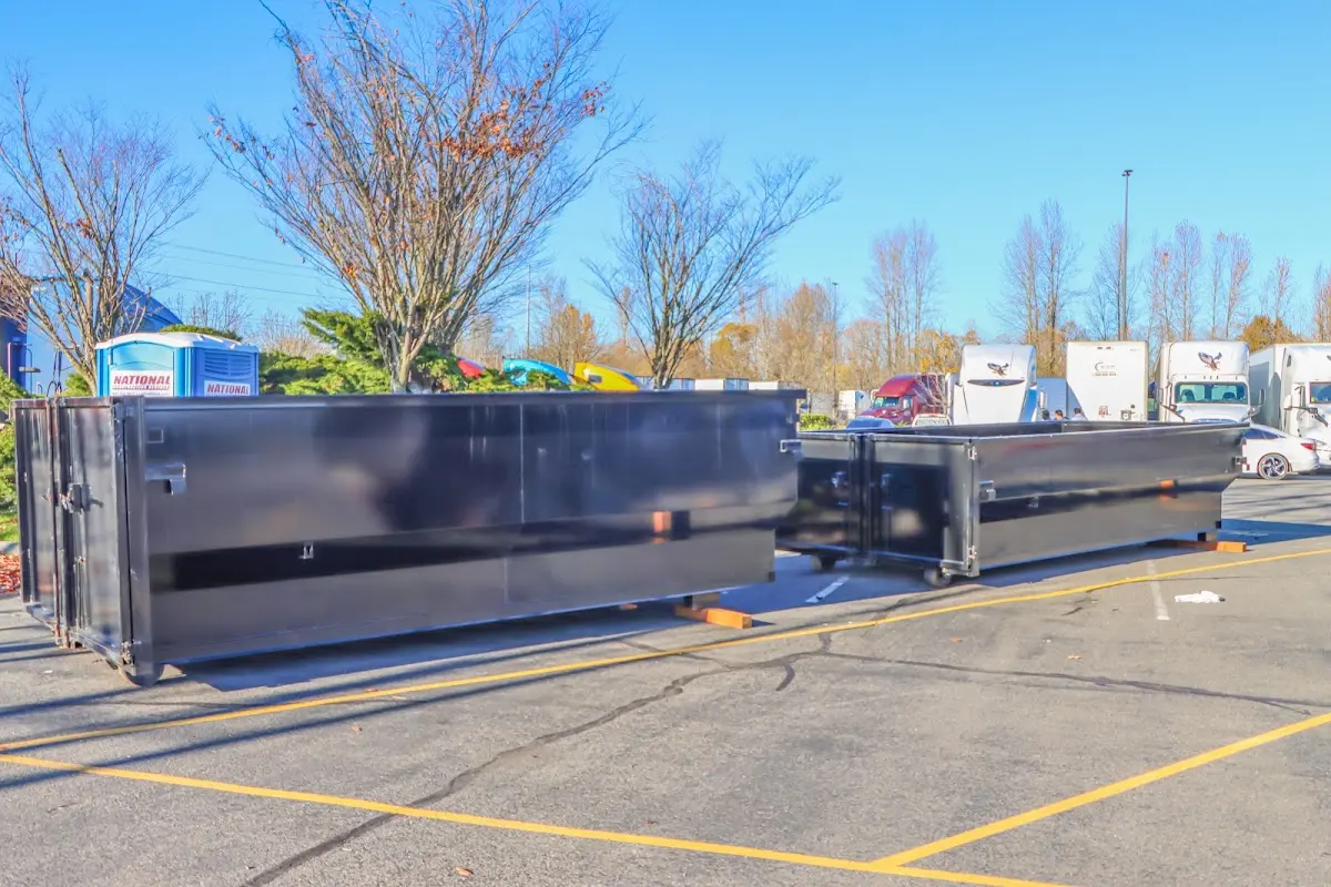 Professional dumpster rental service with roll-off container on residential driveway in Orland